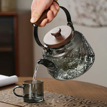 Load image into Gallery viewer, Walnut Handle Glass Teapot on Stove | High Borosilicate Tea Infuser Kettle