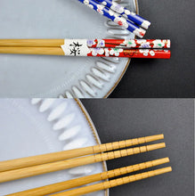 Load image into Gallery viewer, Red &amp; Blue Sakura Chopsticks Gift Set | Bold Japanese Utensils with Chopstick Rests - 2-pair set