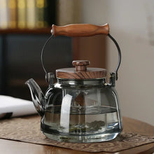 Load image into Gallery viewer, Walnut Handle Glass Teapot on Stove | High Borosilicate Tea Infuser Kettle